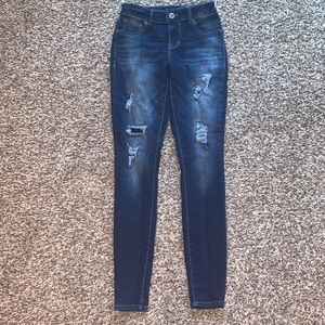 Maurice’s XS Long dark with light faded and ripped/patched skinny jeans.